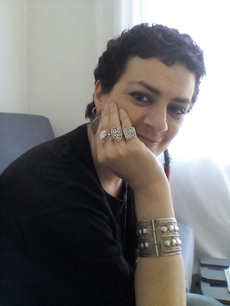 Palestinian artist Rim Banna with Ring Kaf-(Hand of Fatima)- amulet believed to provide protection against the evil eye, worn in Beit Sahur &amp; Al- Sawahreh